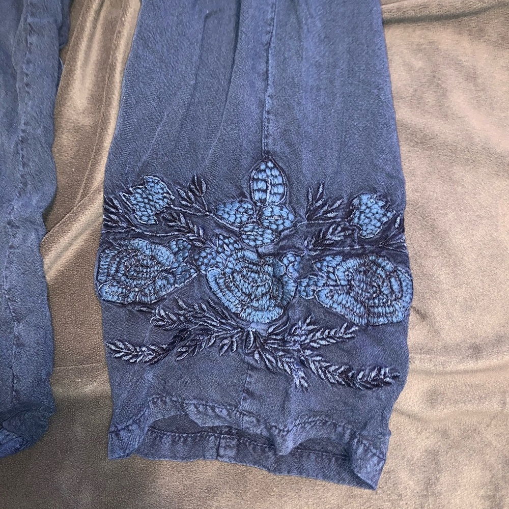 Blue cotton pants, embroidered floral pattern